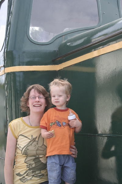 Wolf and Mrs.B posing on a Diesel locomotive